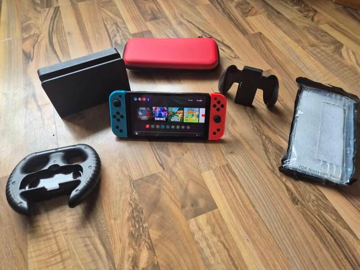 Nintendo Switch OLED with games & accessories - Image 1