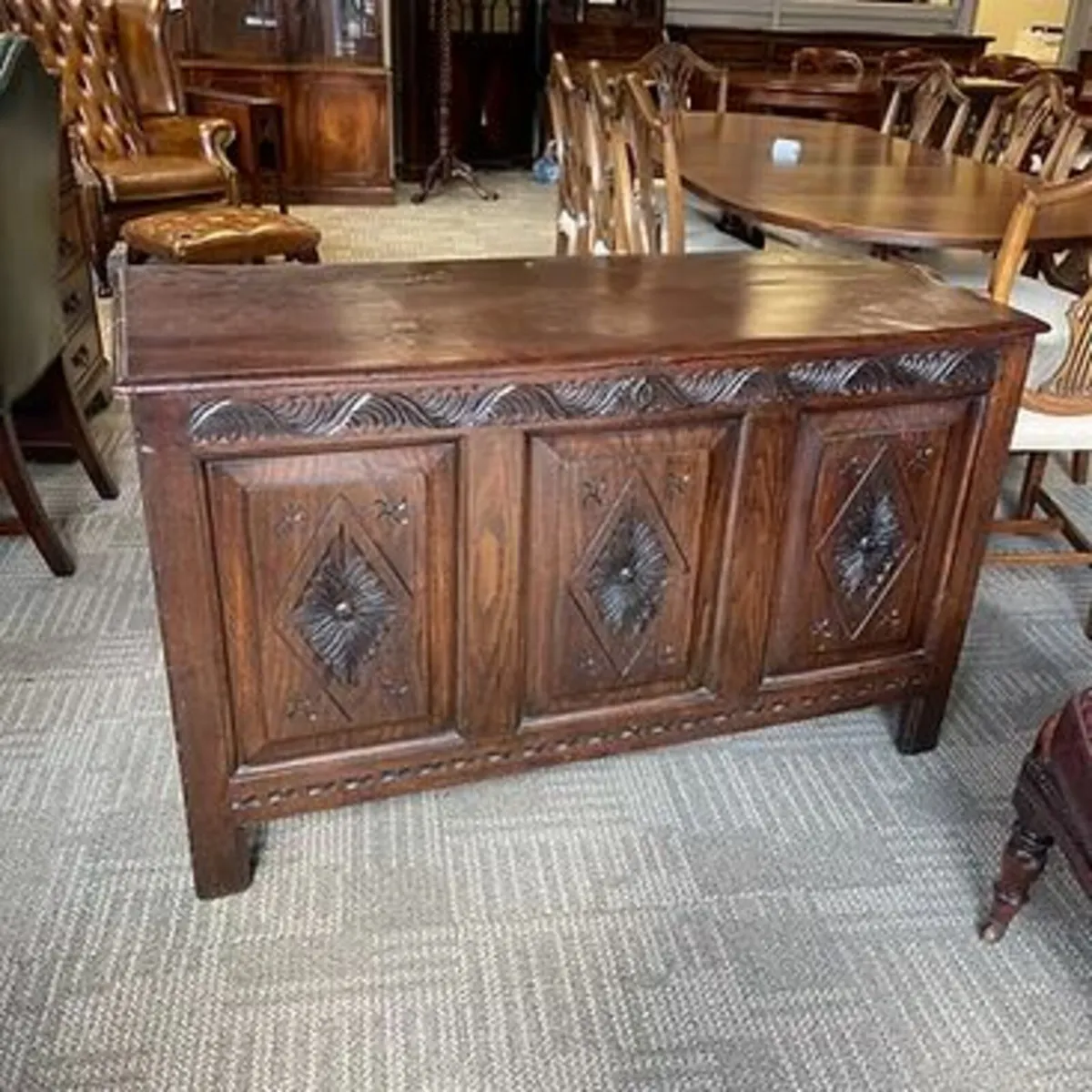 An 18th century carved oak panelled coffer/storage