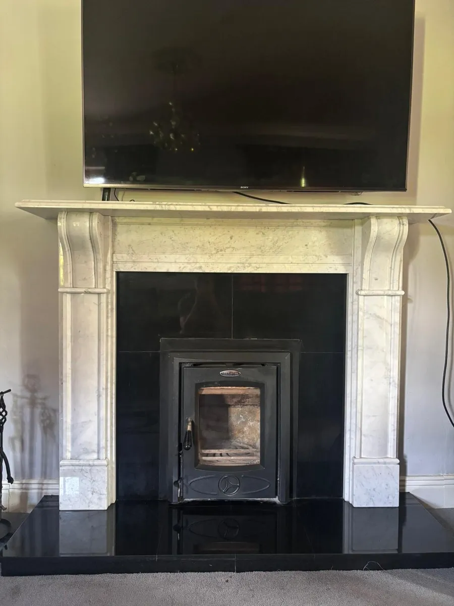 Marble fireplace and Stanley stove - Image 1