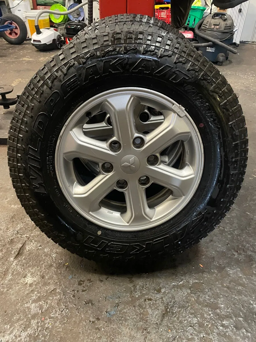 4 Original L200 alloy wheels & tyres as new - Image 3