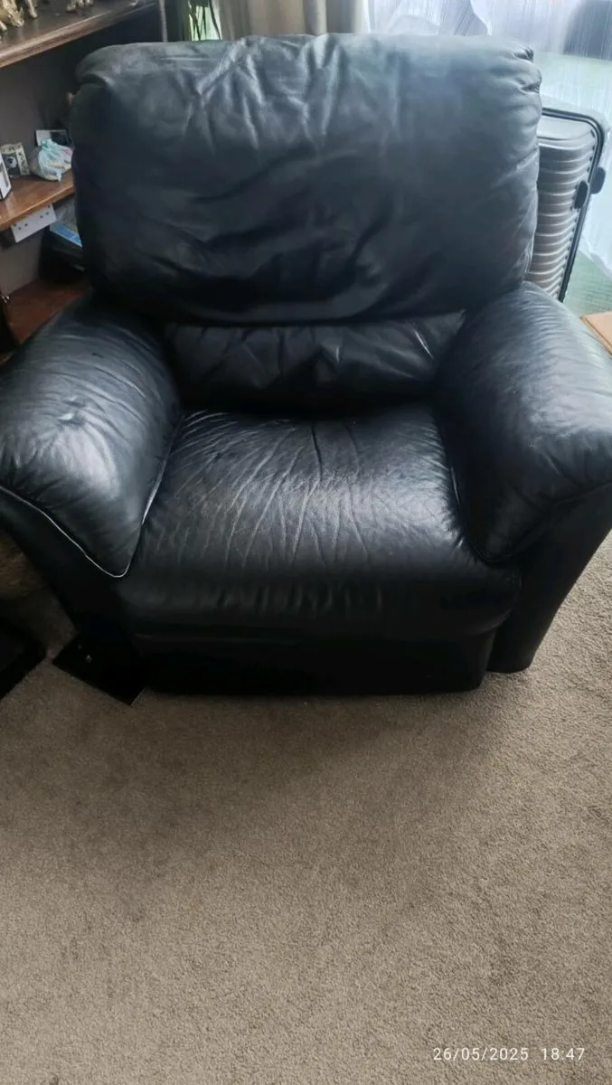 Black and brown leather recliner - Image 1