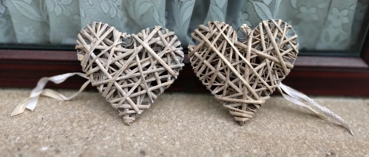 TWO WICKER HEARTS ON A WIRE FRAME (USED). - Image 1