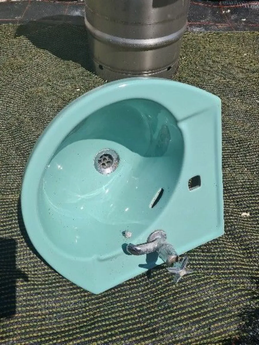 Corner sink pale green in color…. - Image 1