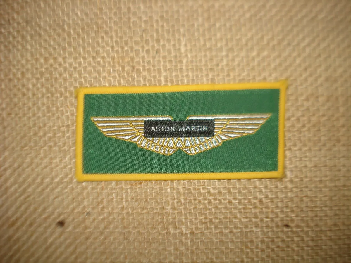 ASTON MARTIN LAGONDA FRAMED 1976 POSTER & BADGE. - Image 2