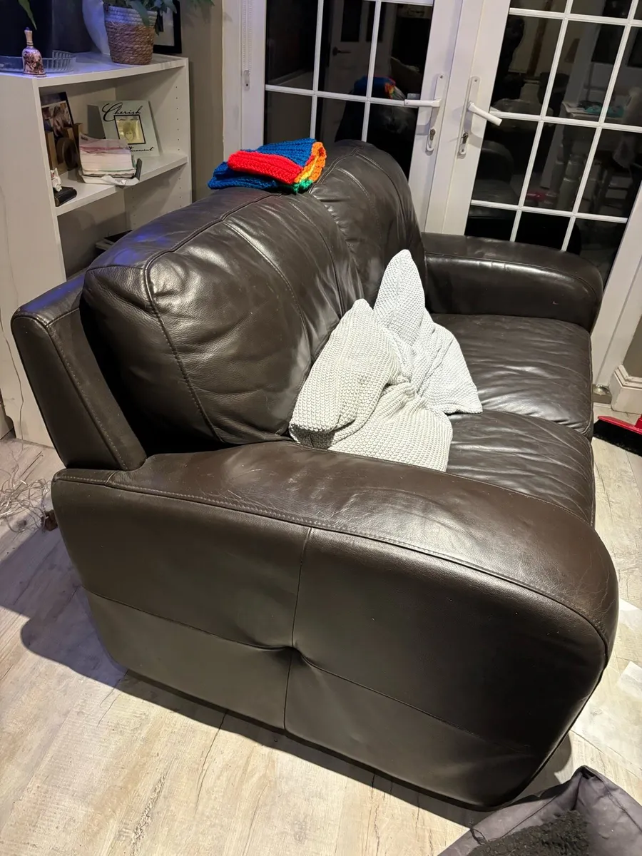 Two seeter brown leather couch perfect condition