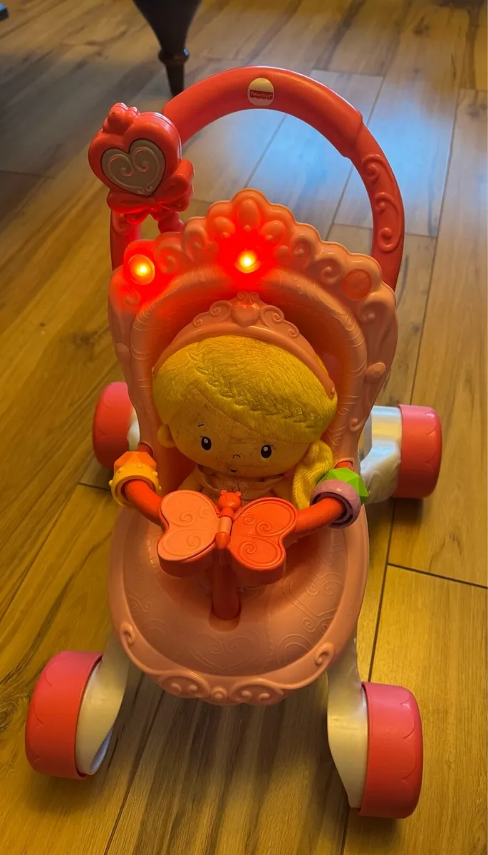 Baby walker with doll