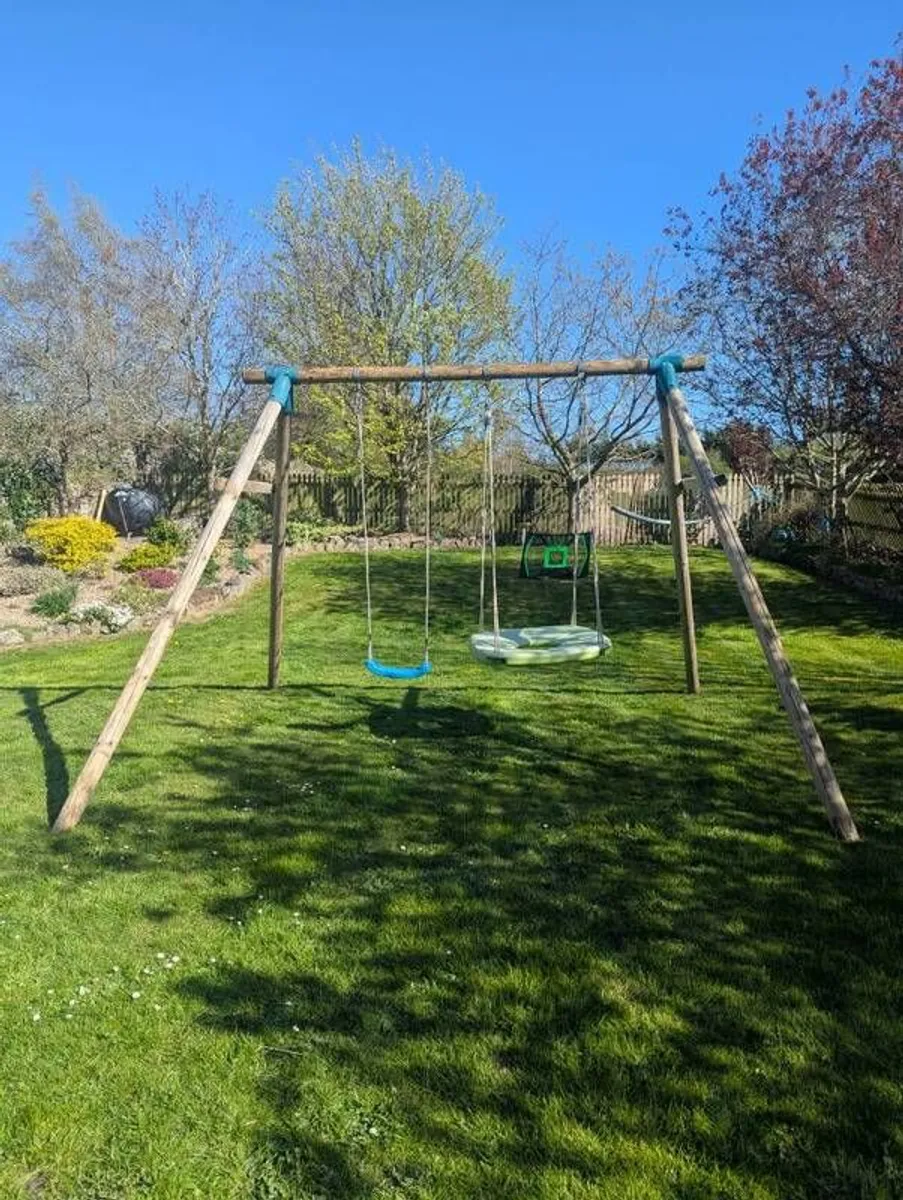 wooden swing set. - Image 1