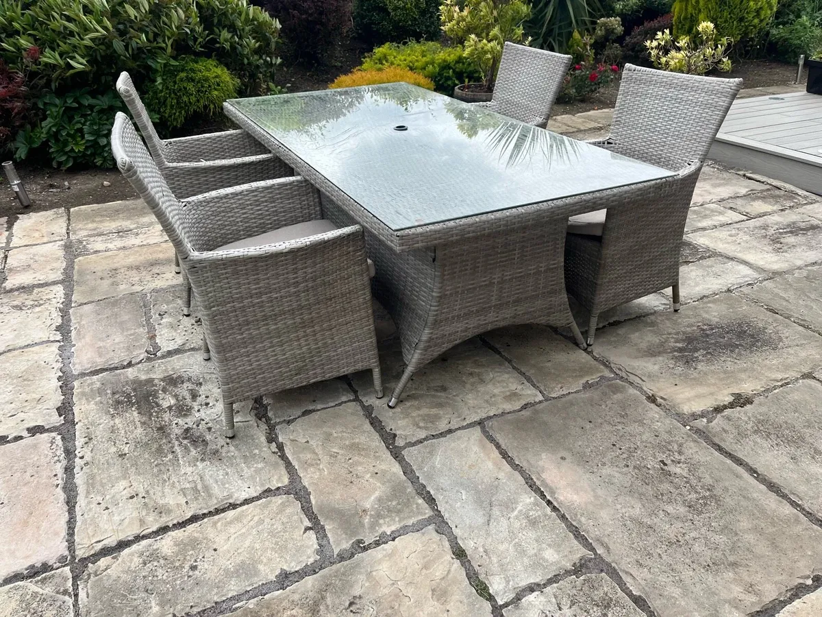 Ratan patio table & four chairs. - Image 1