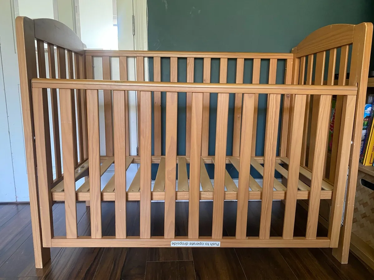 Cot with drop side, adjustable base, mattress - Image 1
