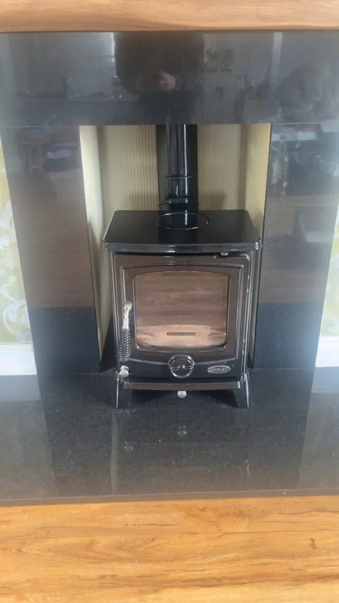Solid fuel stove and surround - Image 1