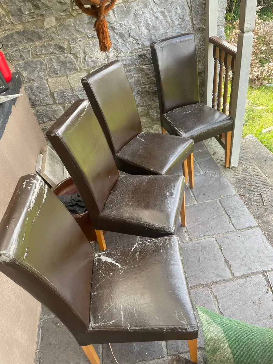 4 brown/black leather chairs with oak legs - Image 1