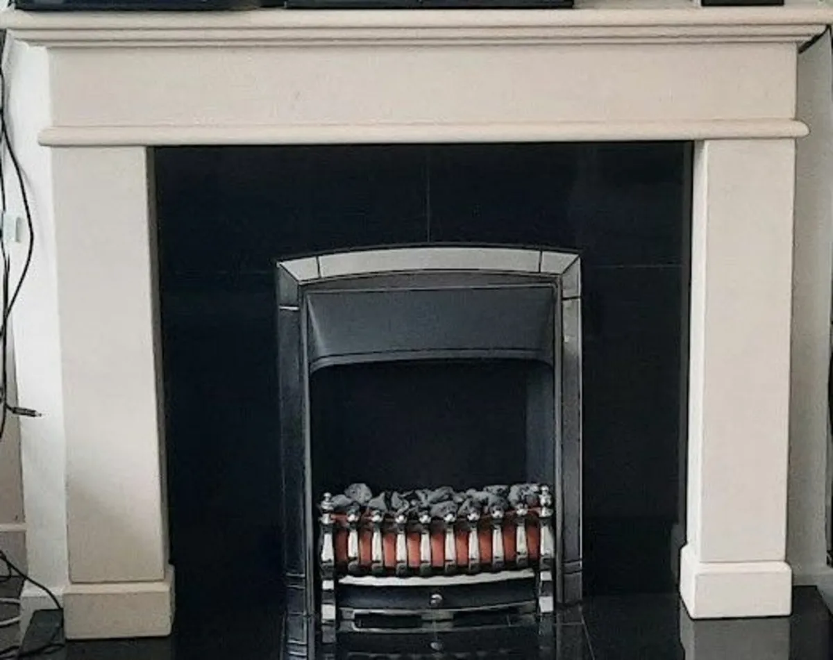 Elegant Limestone Fireplace.