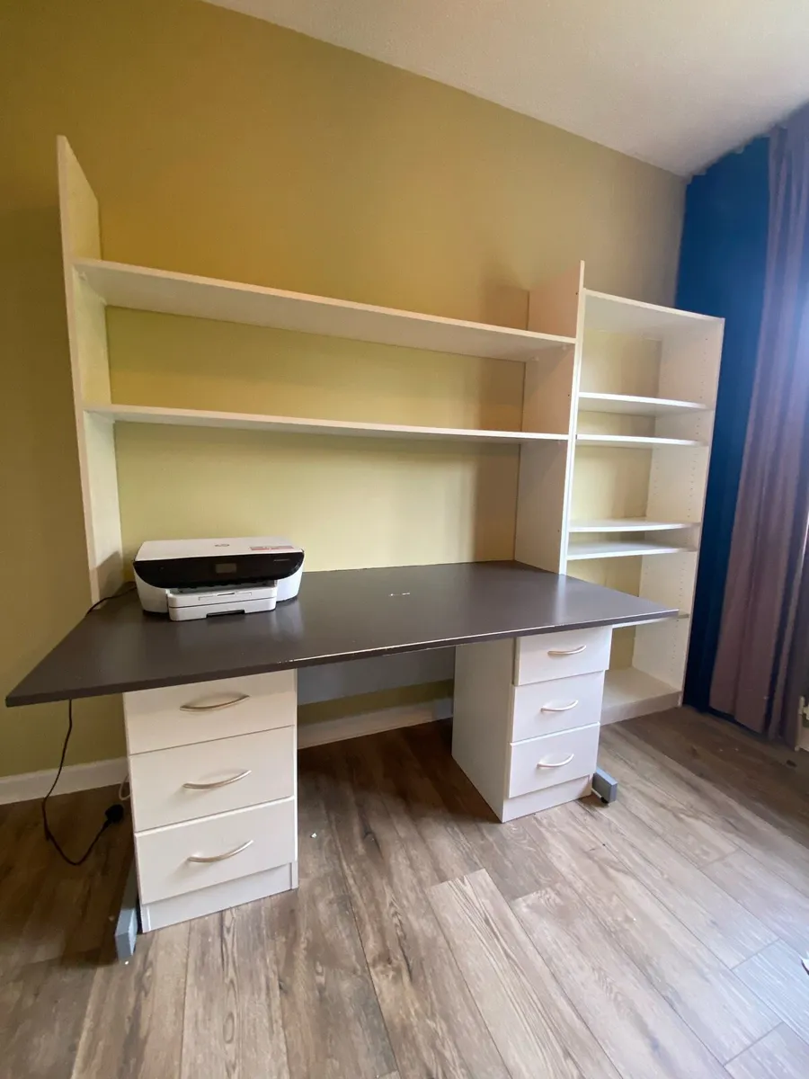 Office  desk and shelving units.