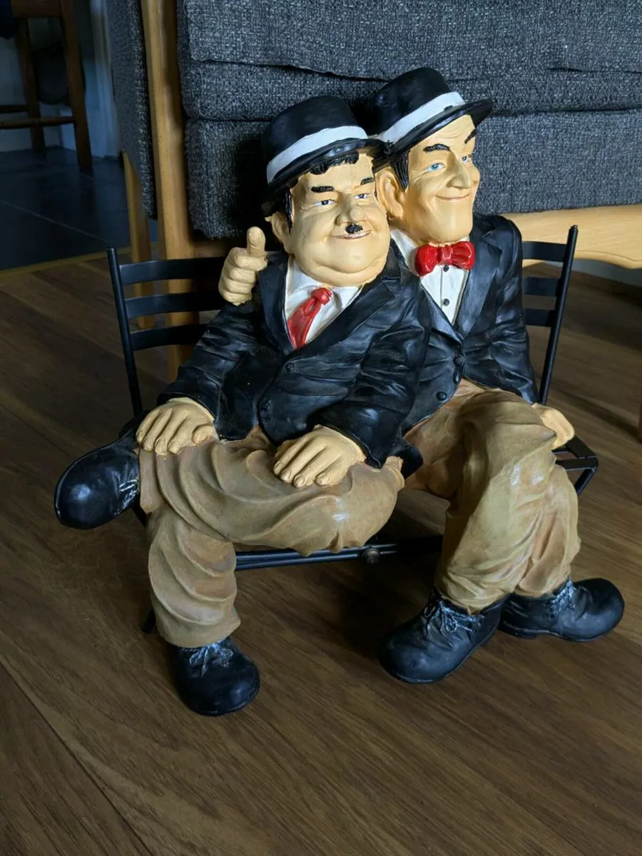Laurel and Hardy figure sitting on a bench - Image 1