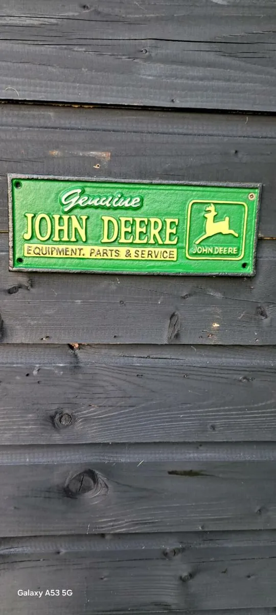 John deer services cast iron sign