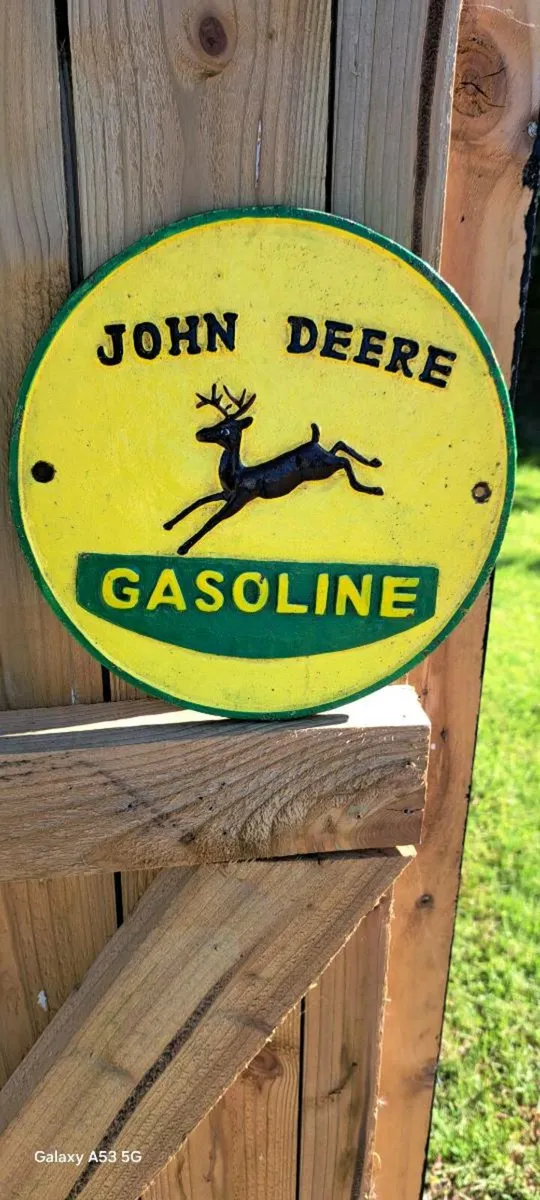 John deer  cast iron sign