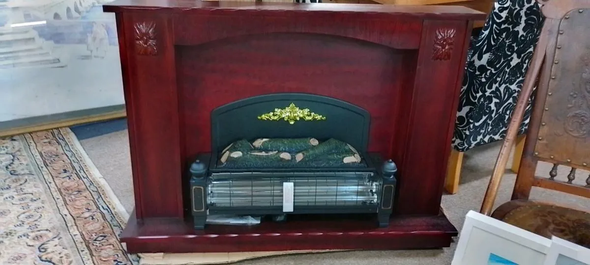 Modern Electric Fire With Wood Surround