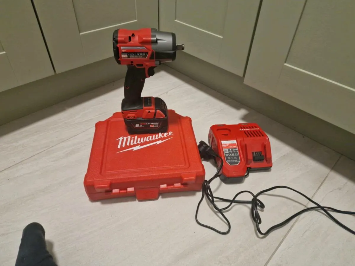 Milwaukee impact wrench, sockets , battery charger - Image 2