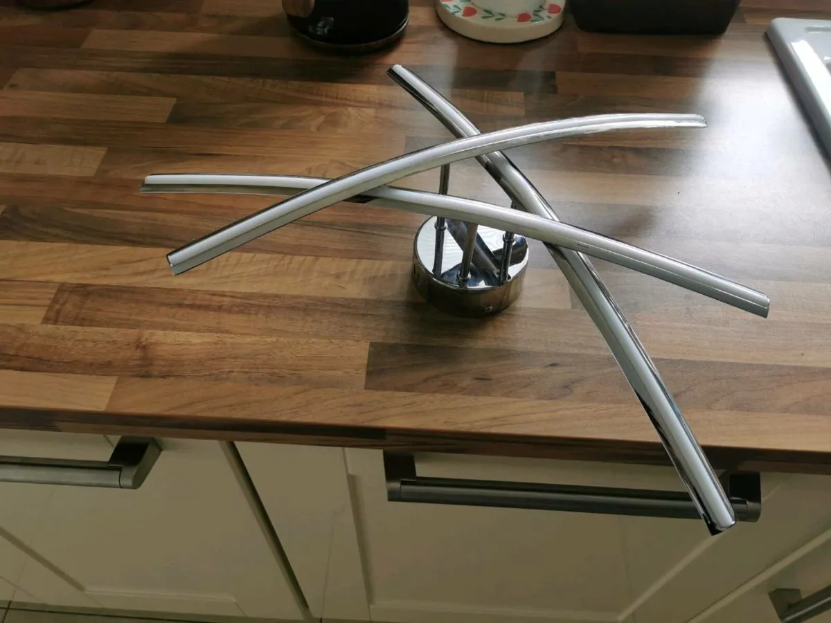 Contemporary chrome light fitting