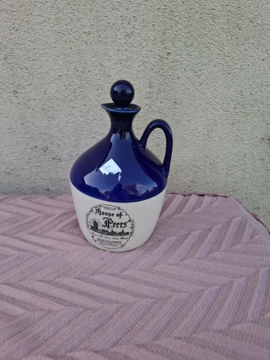Blue whiskey bottle postage possible