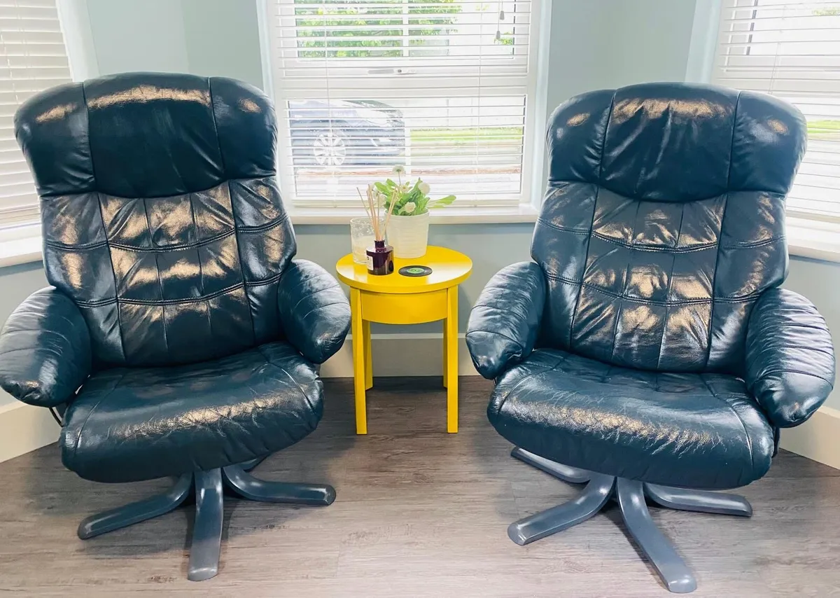 A pair of Blue Leather Recliner & Swivel Armchairs