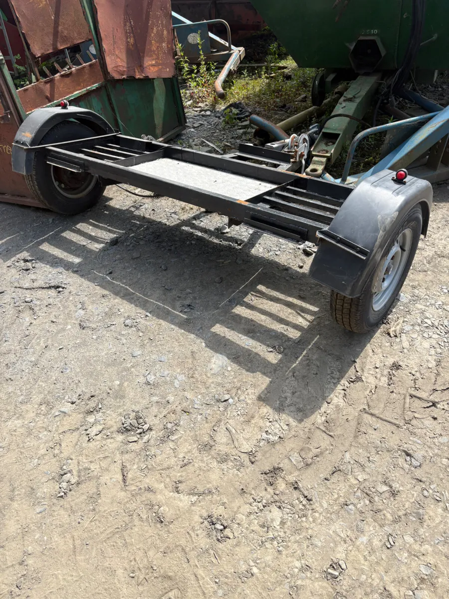 Car towing trailer