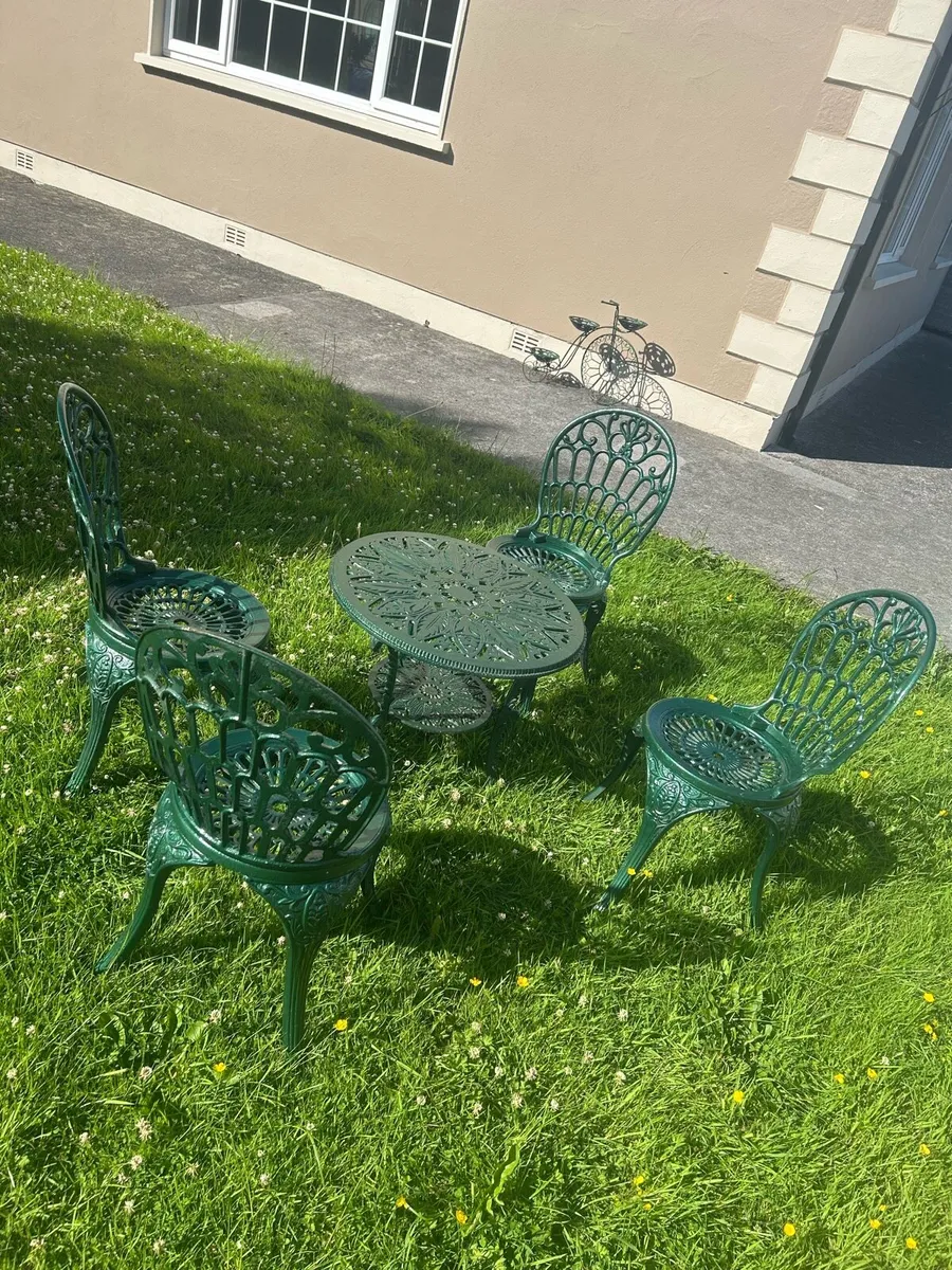 Cast iron table and four chairs