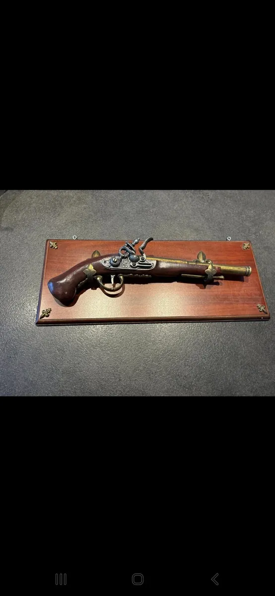 Vintage pistol replica decor with display