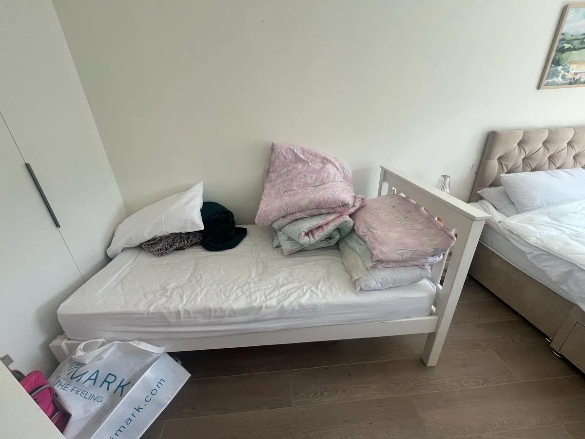 Single white wooden bed
