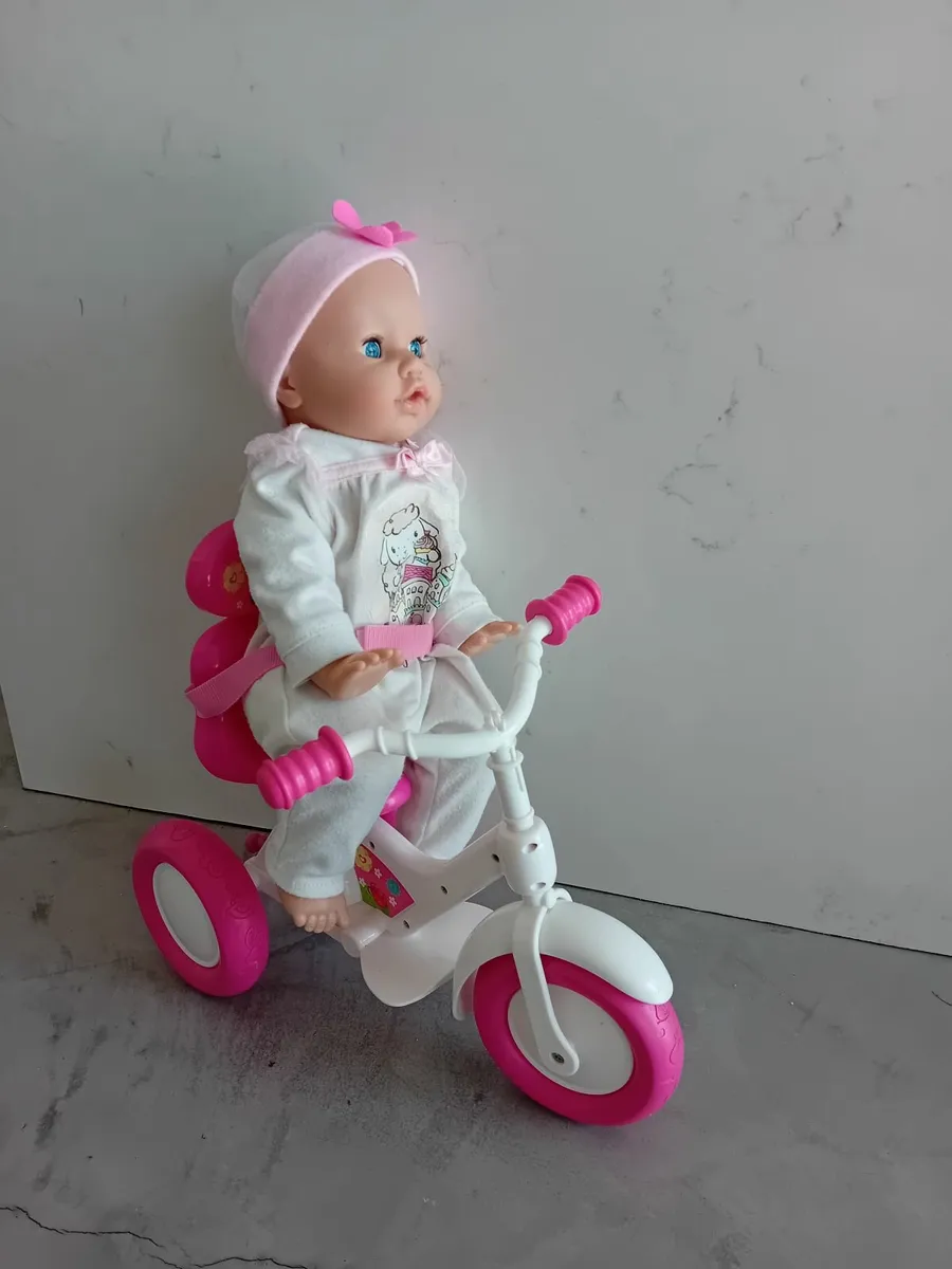 Doll and bike