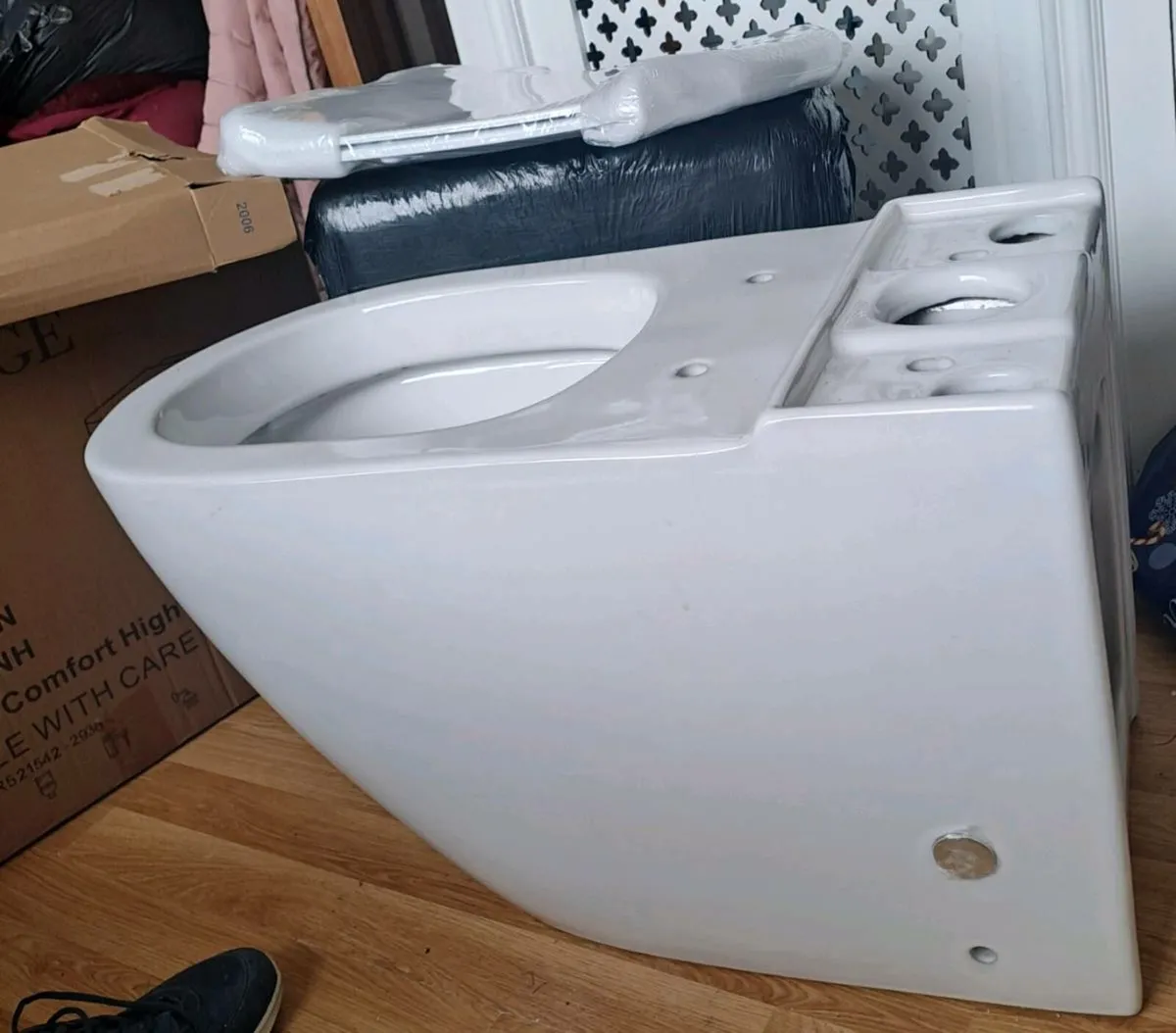 Brand new toilet with cistern and toilet lid
