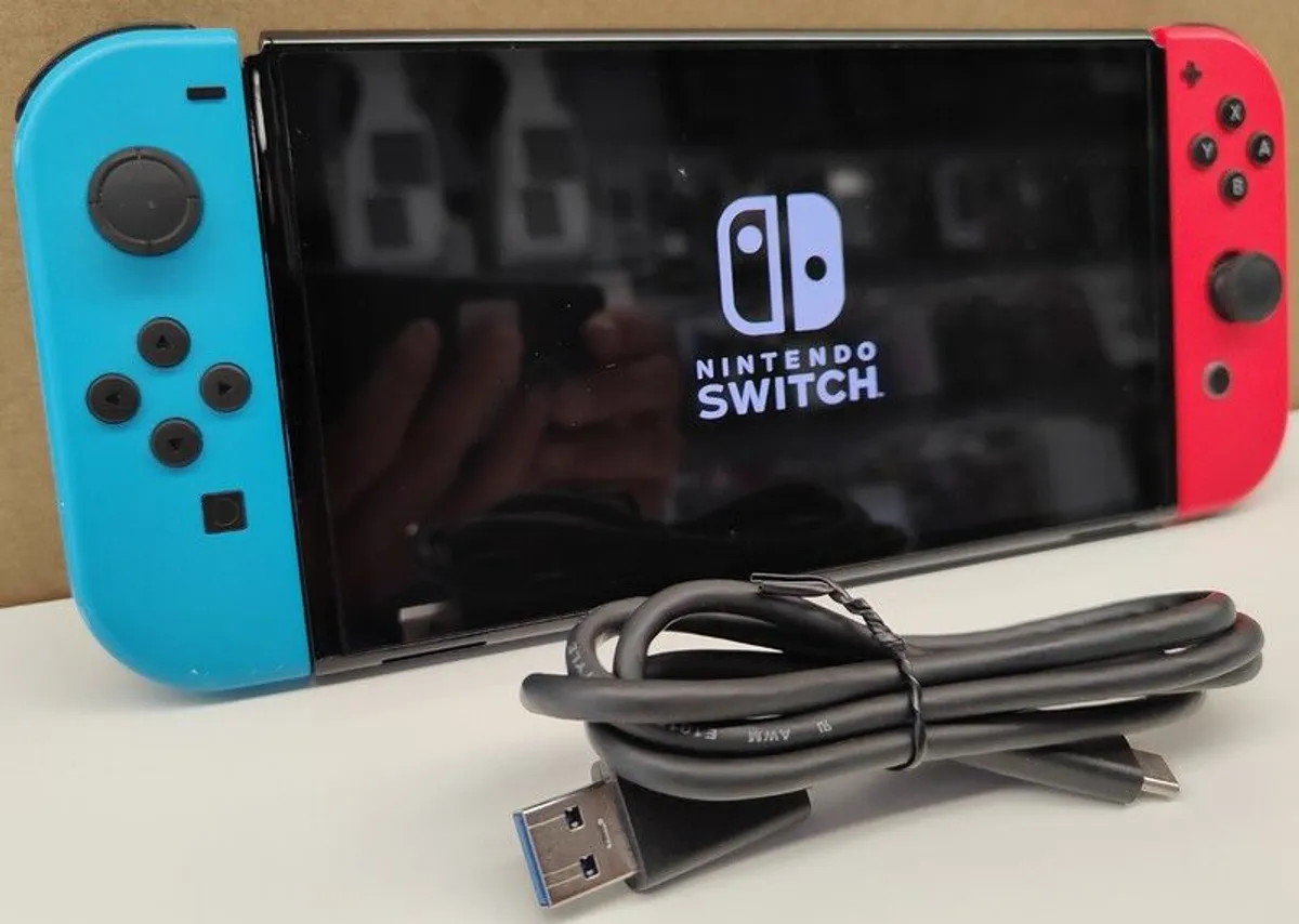 Nintendo Switch OLED 64GB Console + Joy-Cons + 128GB SD Card - Image 1