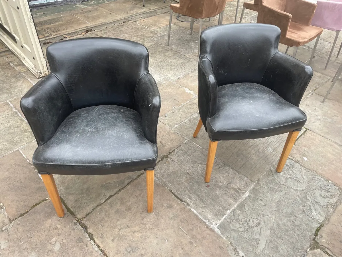 A pair of suede and leather chairs - Image 1