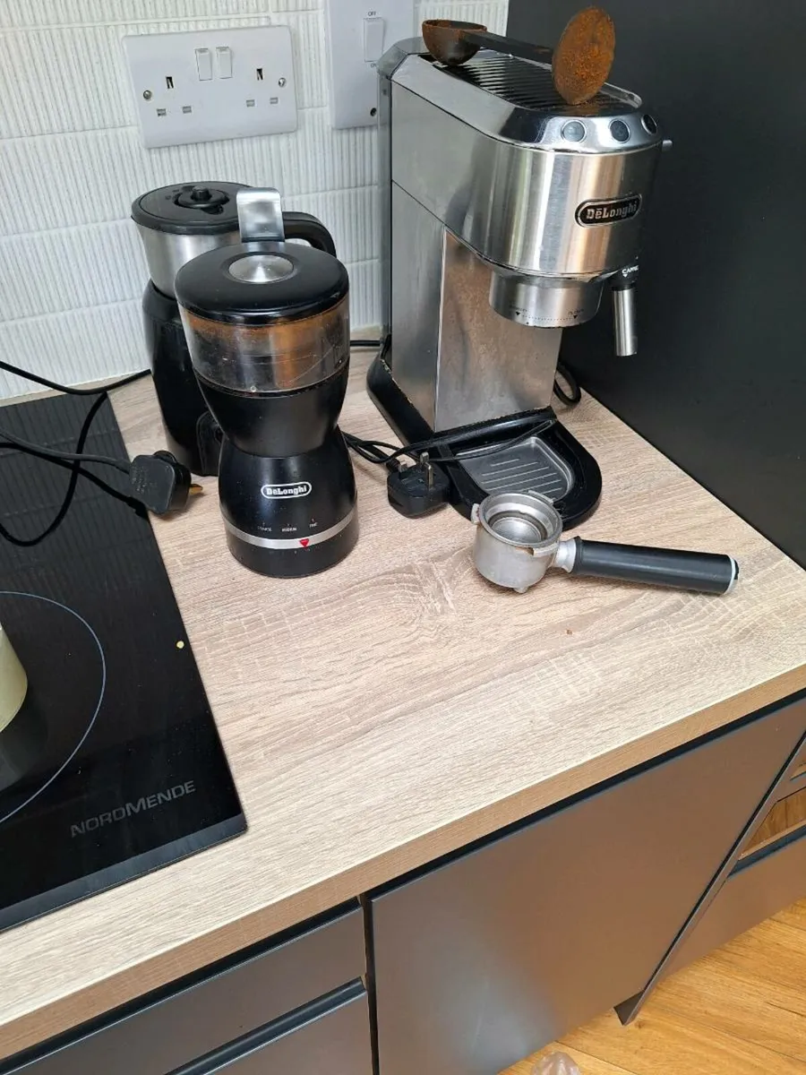 Coffee machine milk frother and coffee grinder