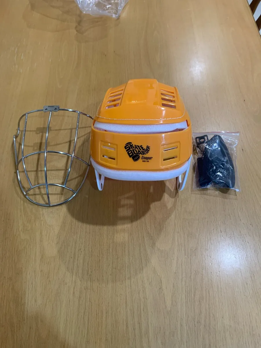 Skateboarder hurling helmet - Image 1