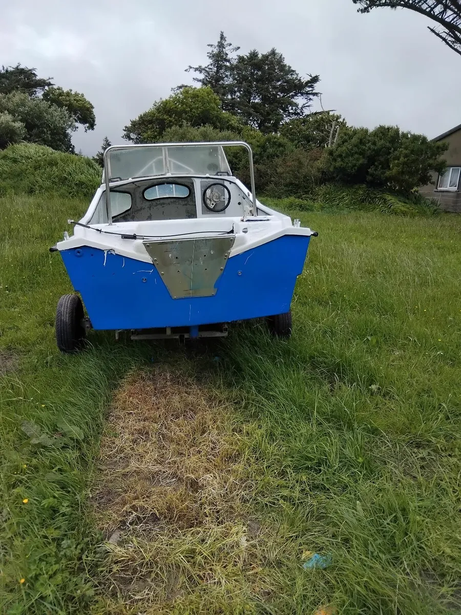 Boat and trailer. - Image 1