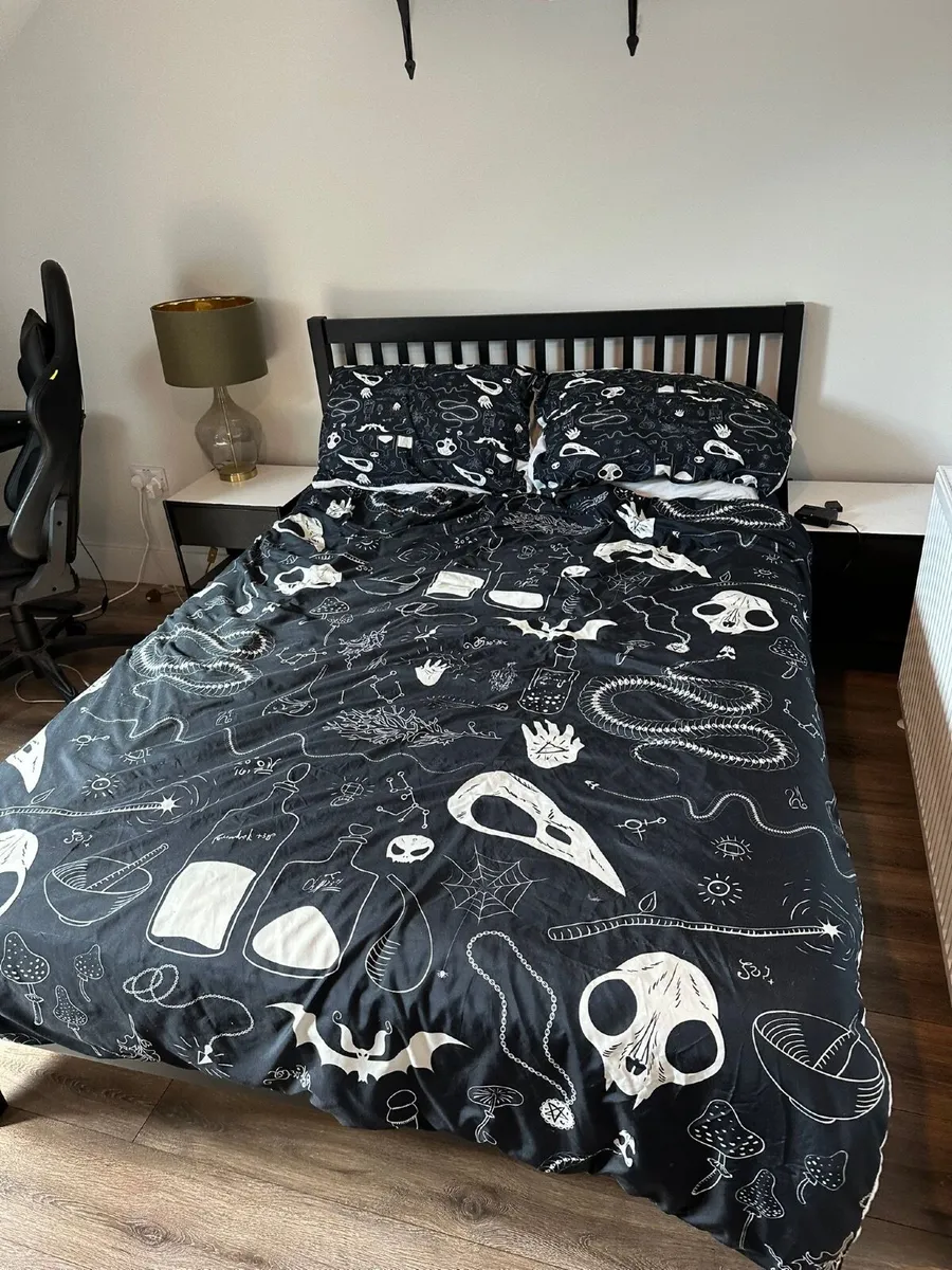 Bedframe including mattress, duvet and pillows.