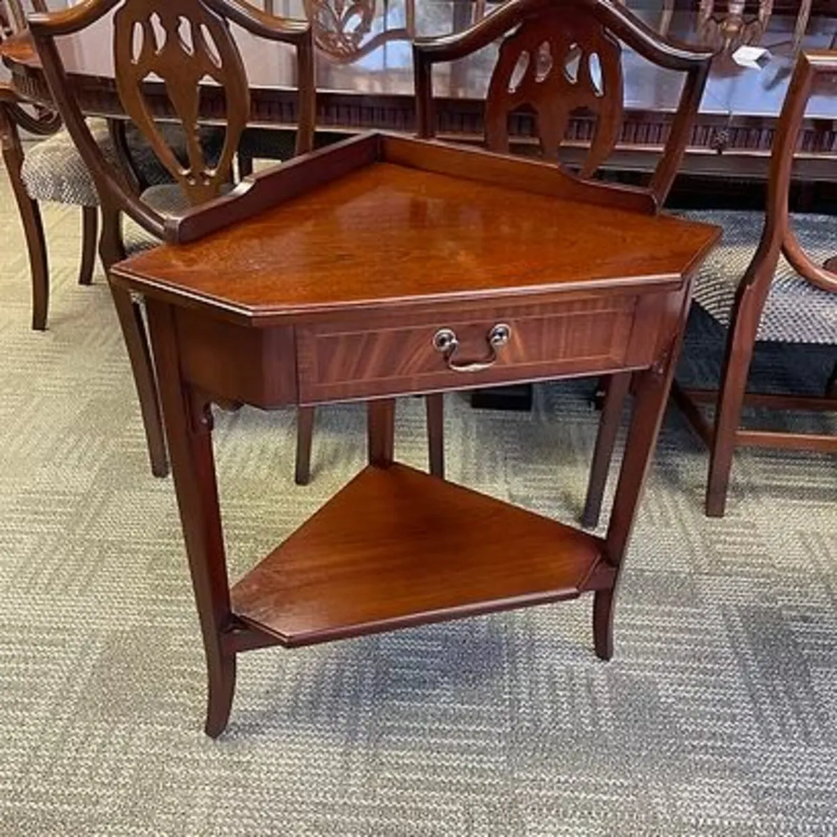 Fabulous mahogany corner unit with single drawer.