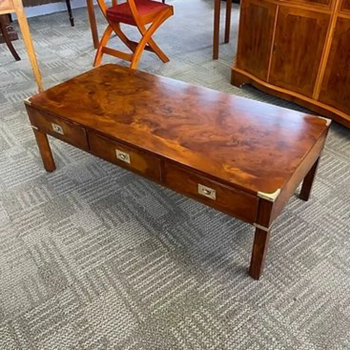 Beautiful yew campaign coffee table. Enclosed with
