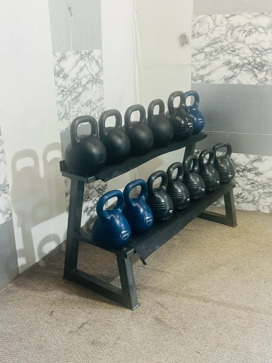 Collection of kettlebells with rack - Image 1