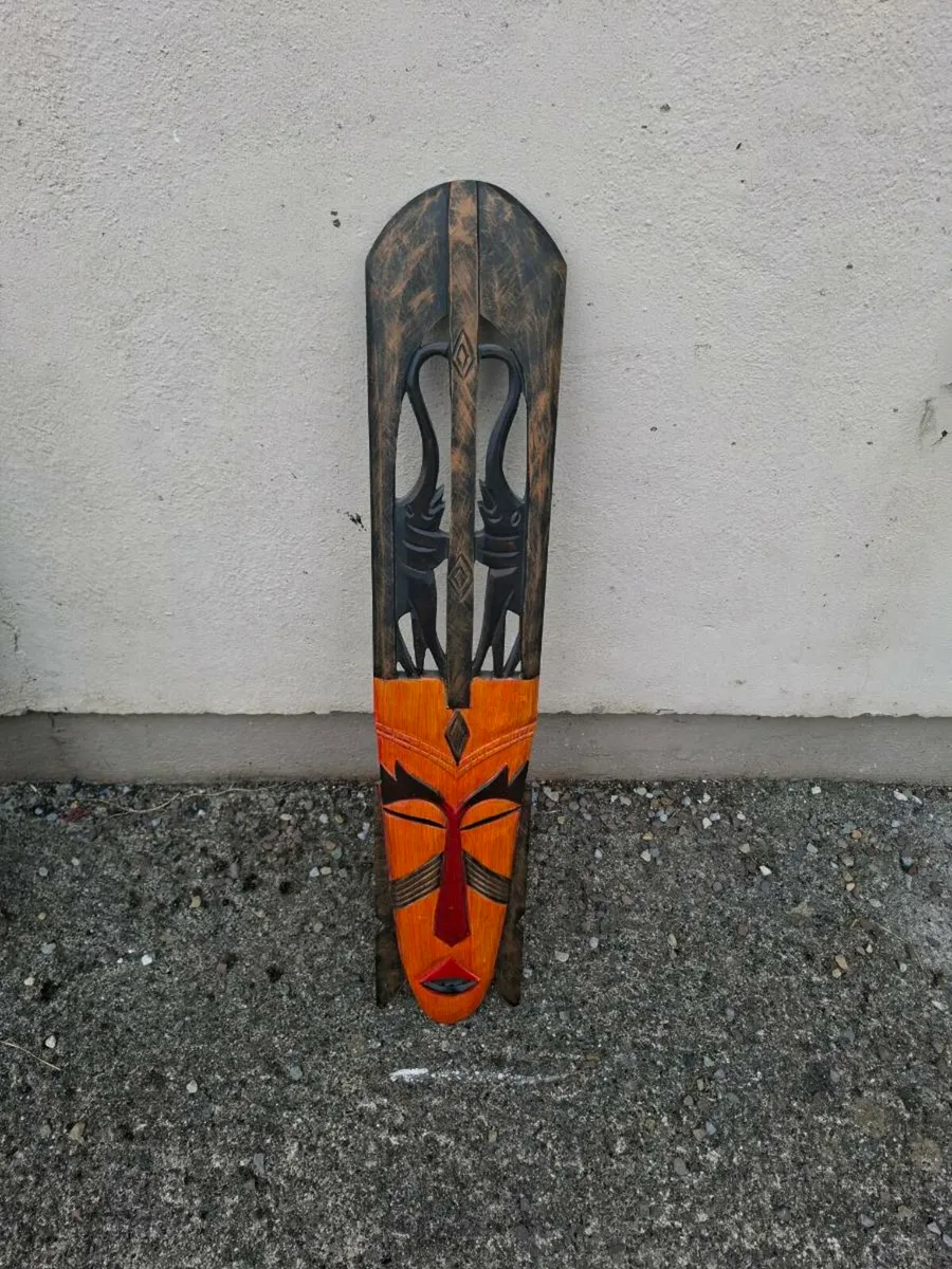 Orange and wood african wood mask