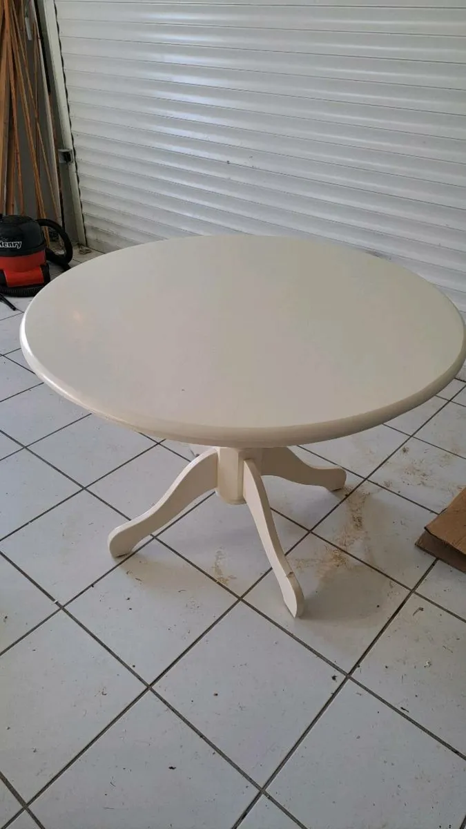 White circular IKEA dining /  kitchen table