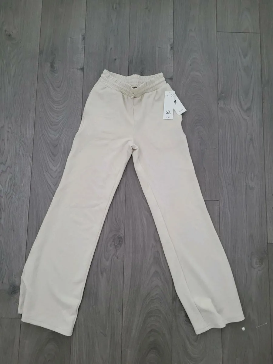 Brand new cream tracksuit bottoms. - Image 1