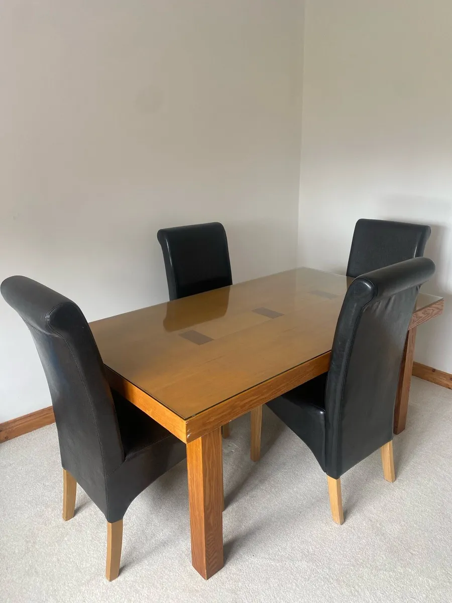 Glass topped wooden Dining table with 4 chairs - Image 1