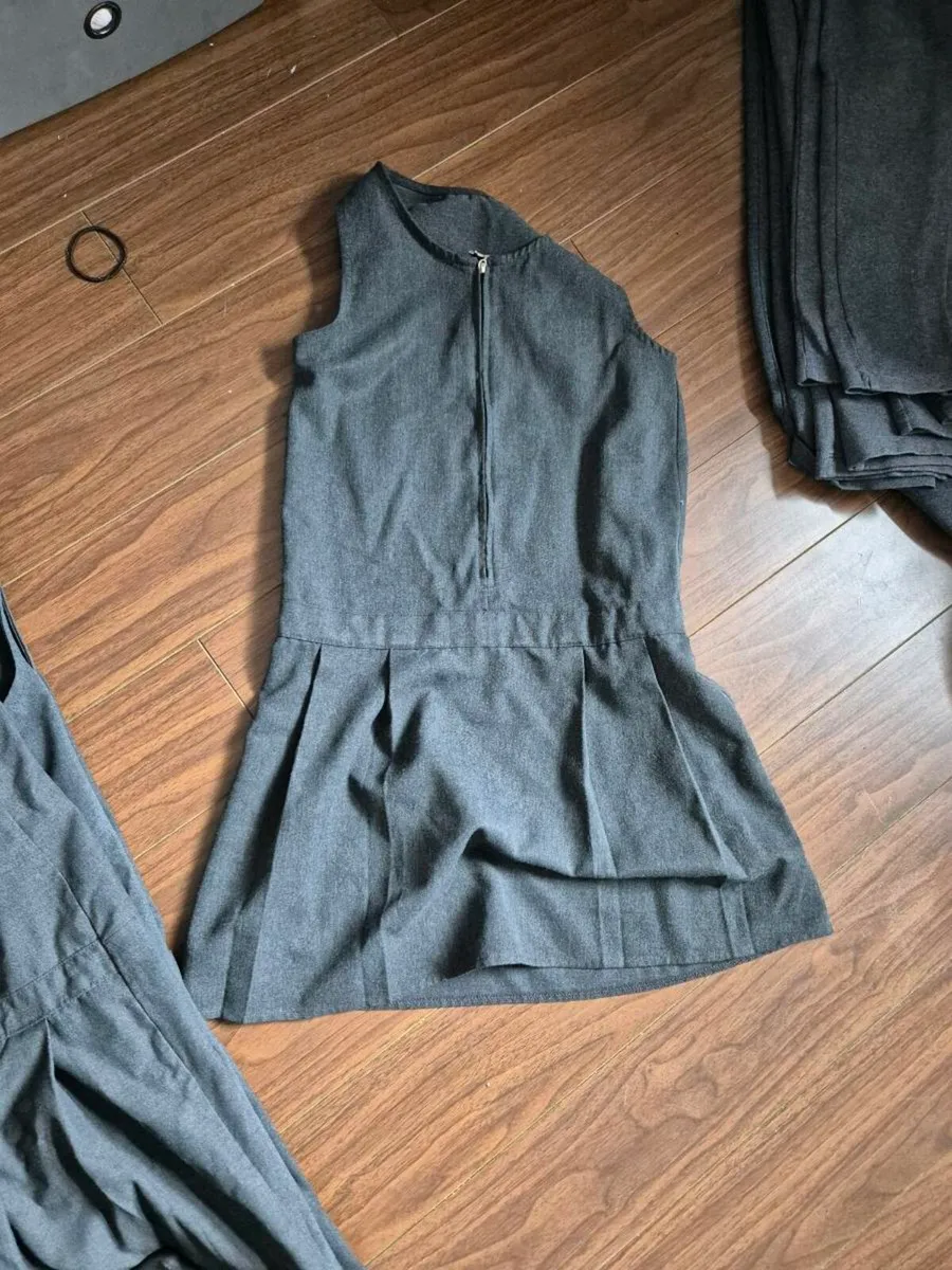 Girls school uniforms grey dresses, skirts and pam - Image 1