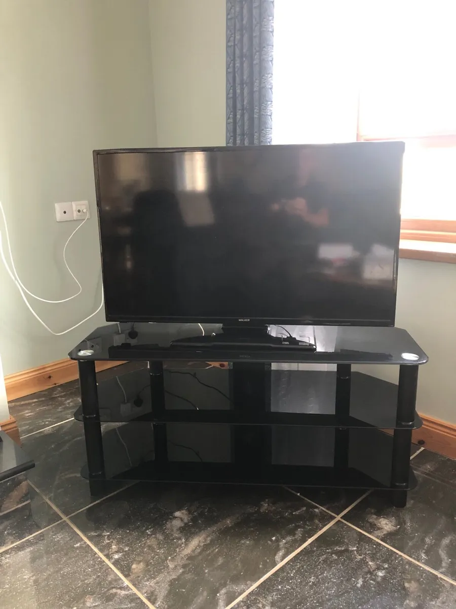 Smart Tv and glass stand - Image 1