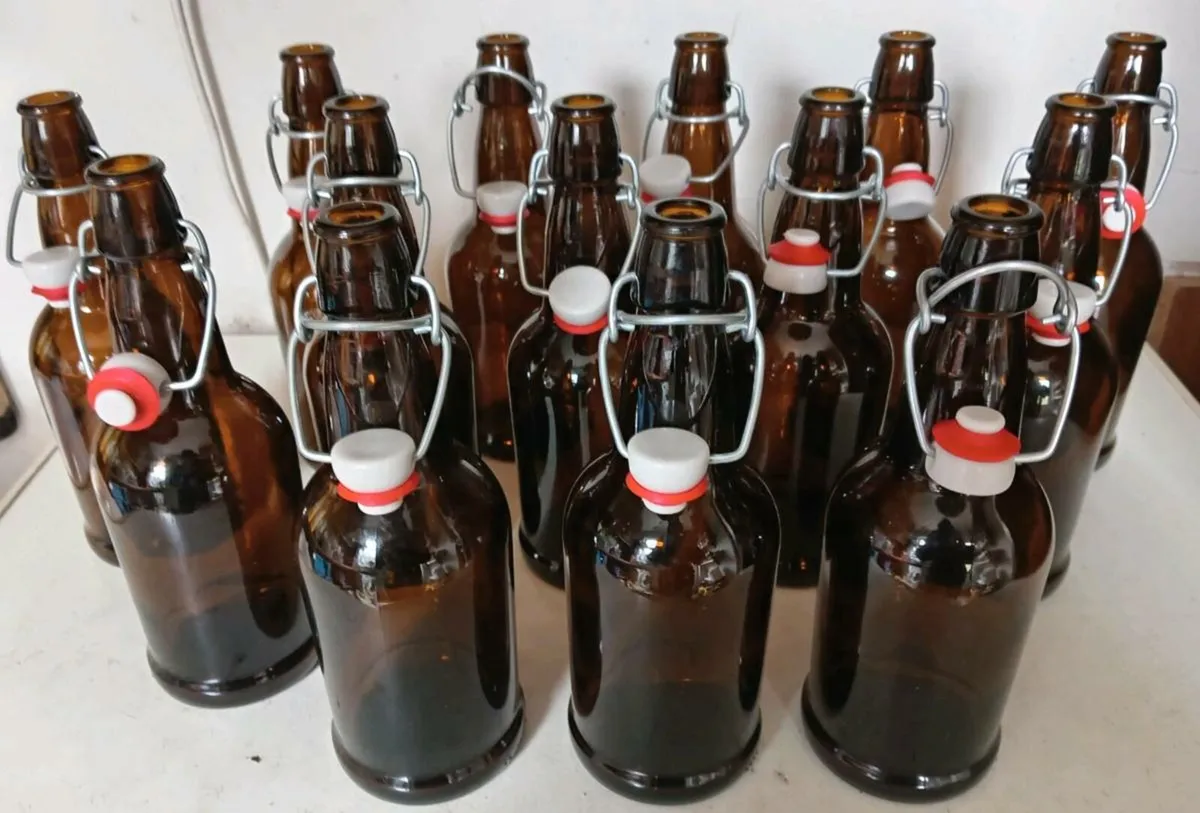 Fourteen Beer Bottles With Lids for Home Brewing