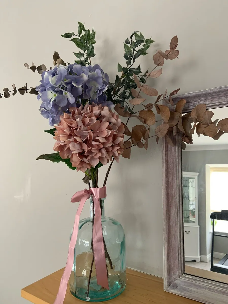 Artificial Hydrangeas in a glass vase