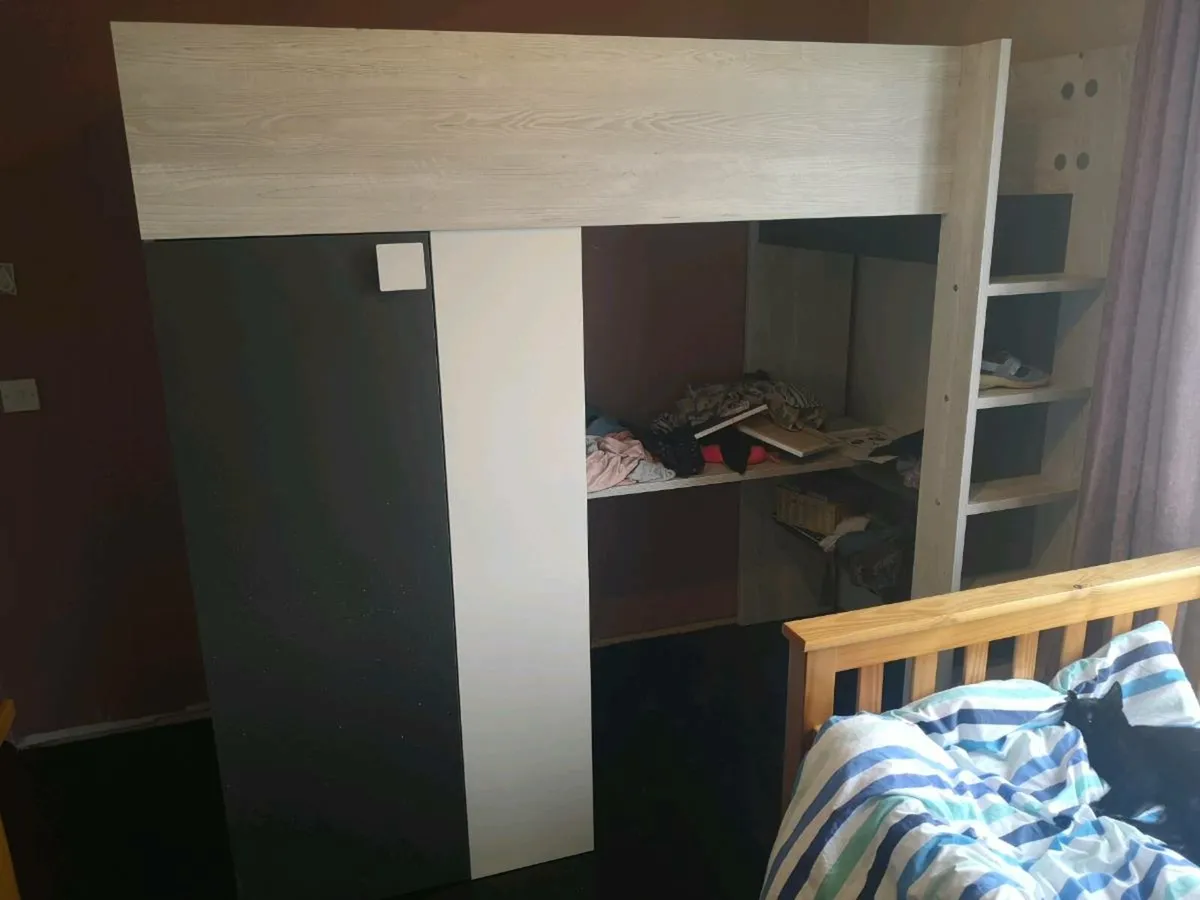 Bed with closet and writing area. - Image 2