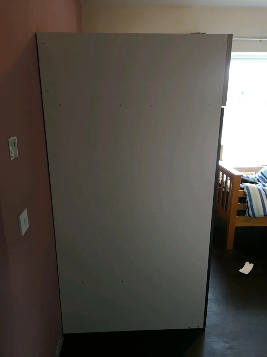 Bed with closet and writing area. - Image 3
